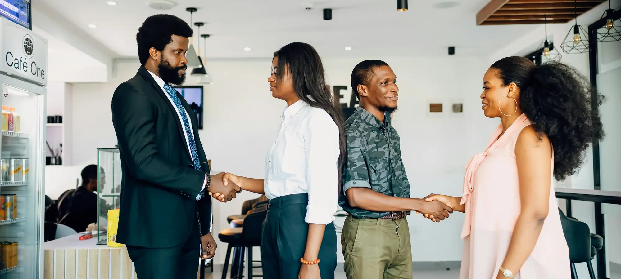 Customer success team greeting clients in an office