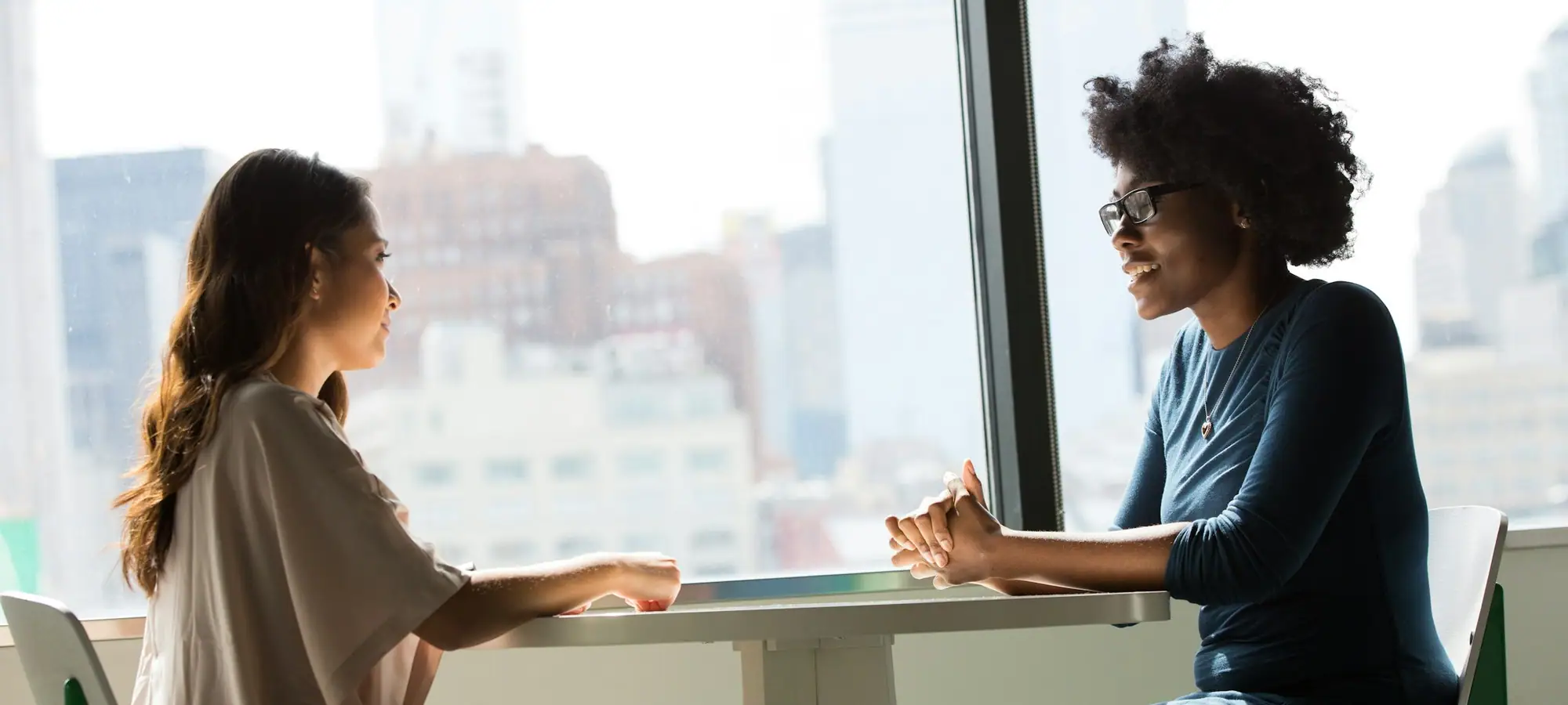 Two colleagues in a one-on-one conversation