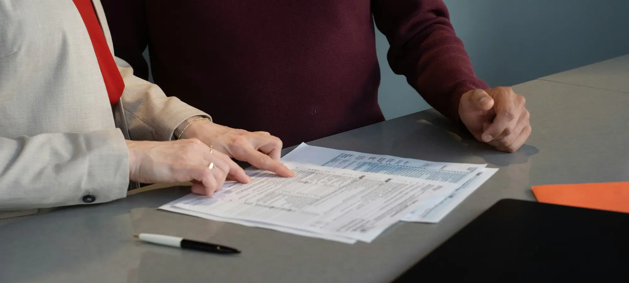 Compliance team reviewing documents at a table