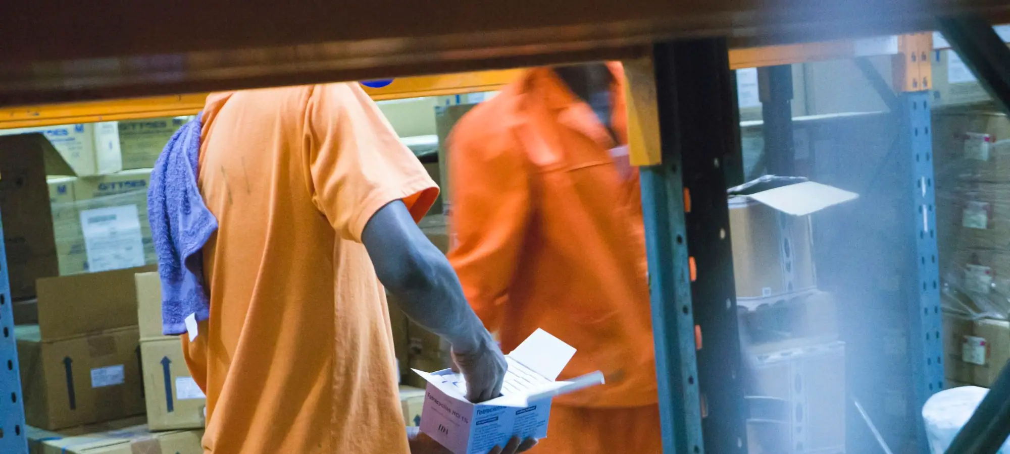 Warehouse operations staff handling inventory