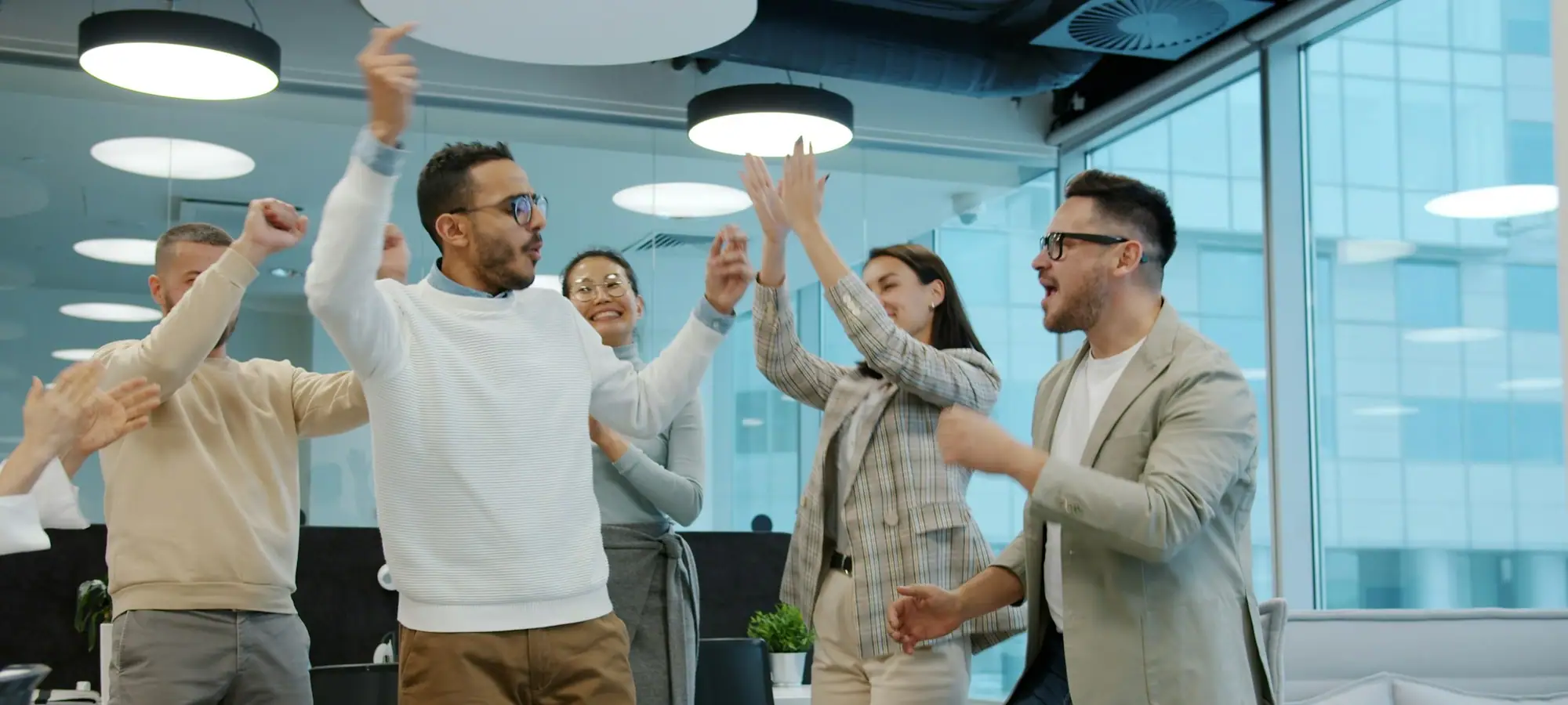 Colleagues celebrating a success in the office