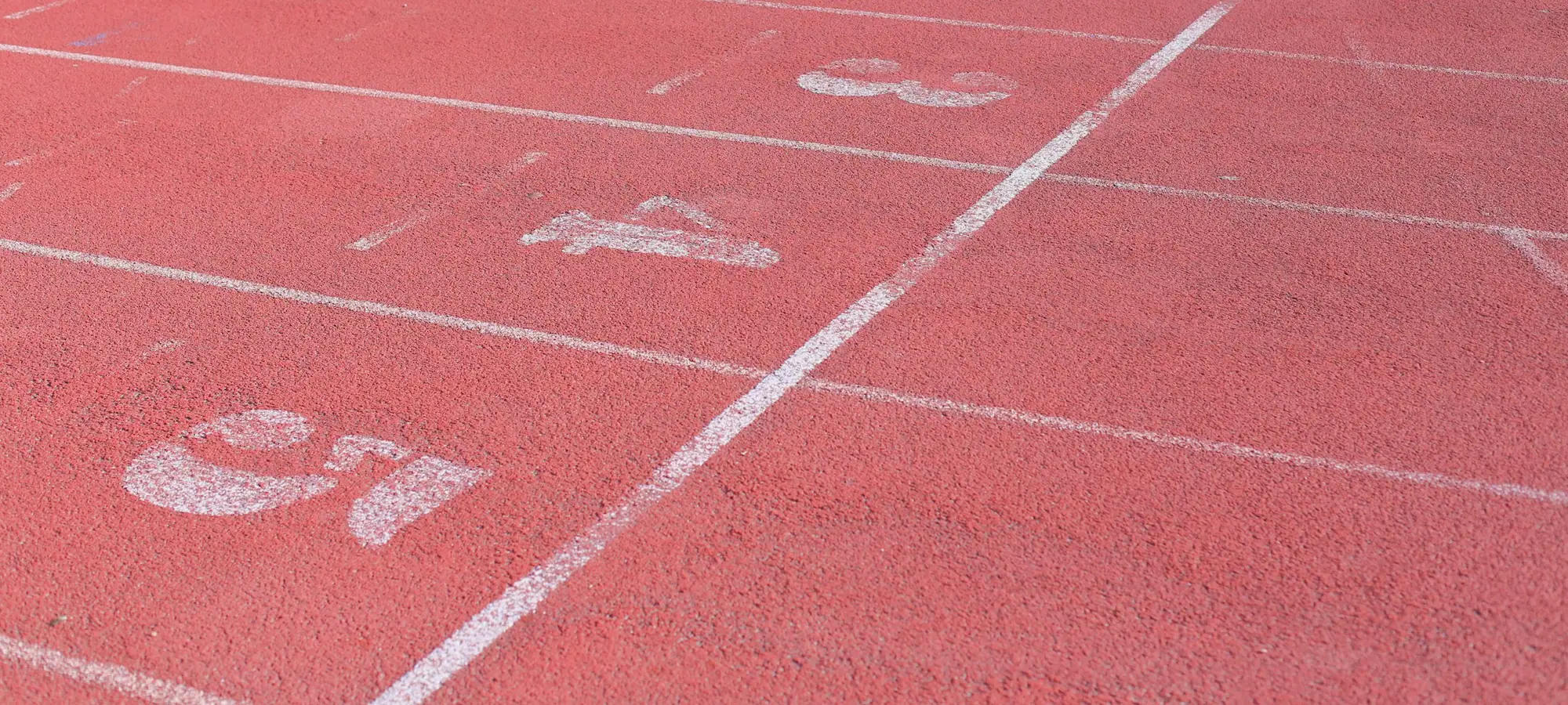 Numbered lanes on a red running track