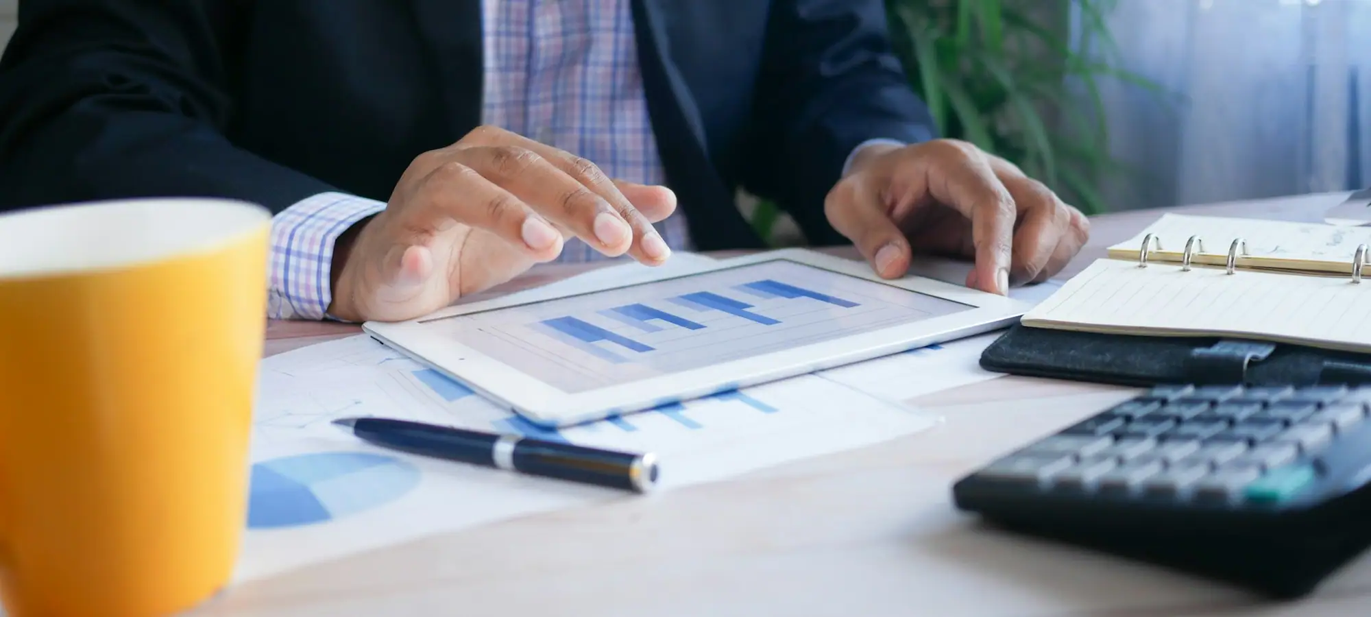 Manager reviewing performance charts on a tablet