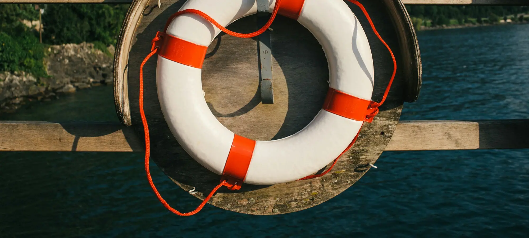 Life ring hanging on a wooden dock
