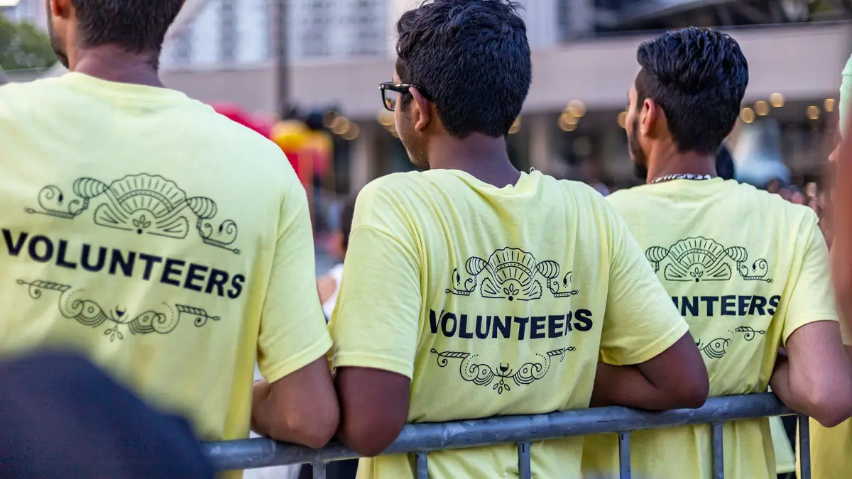Volunteers in matching shirts at a community event