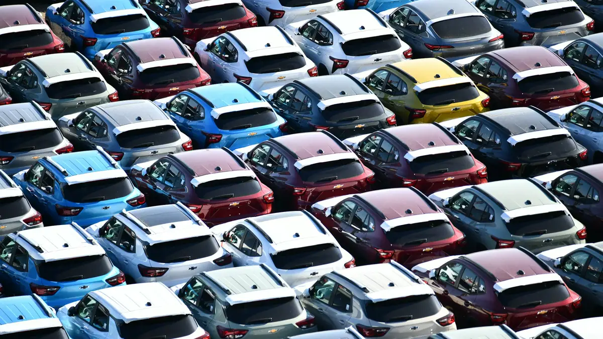 Rows of new cars on a dealership lot