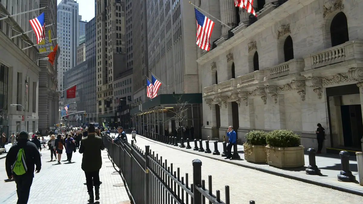 Wall Street and the New York Stock Exchange with American flags