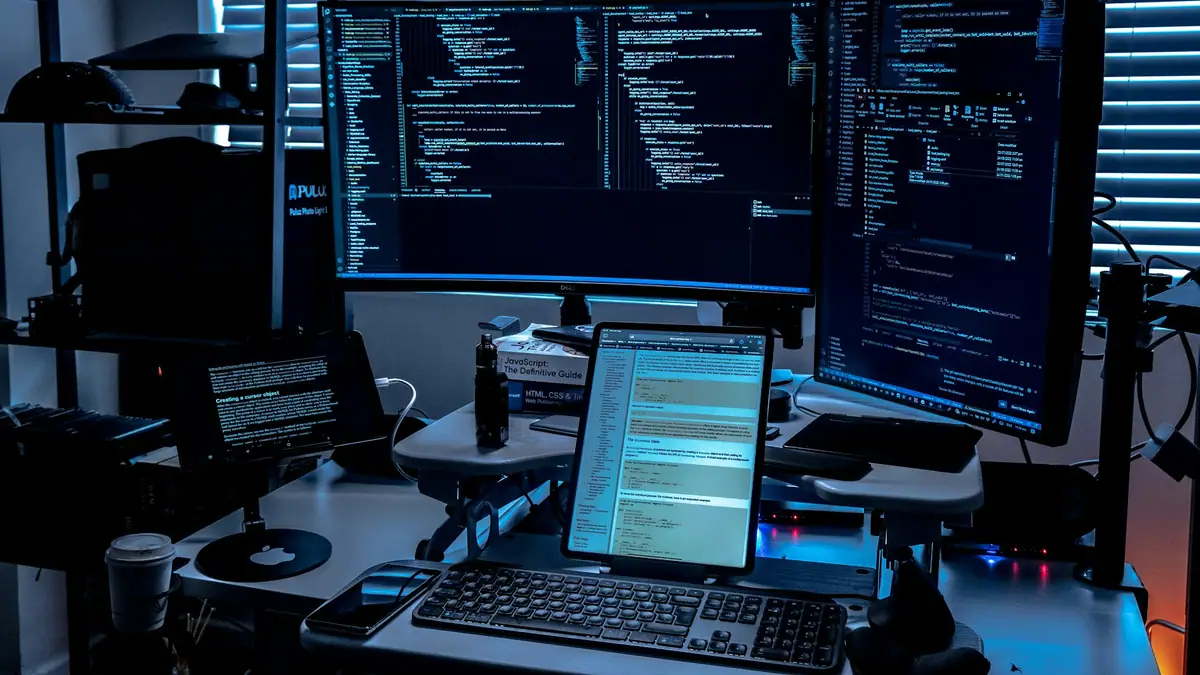 Security operations desk with multiple code monitors