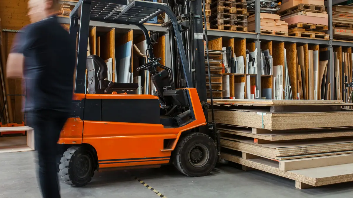 Forklift moving materials in a distribution warehouse