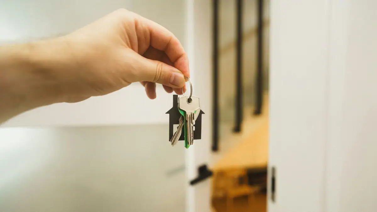 Hand holding the keys to a new home