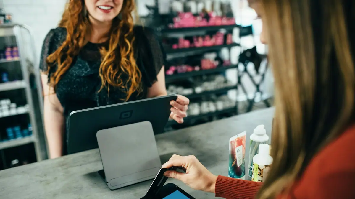 Merchant using a tablet point-of-sale system