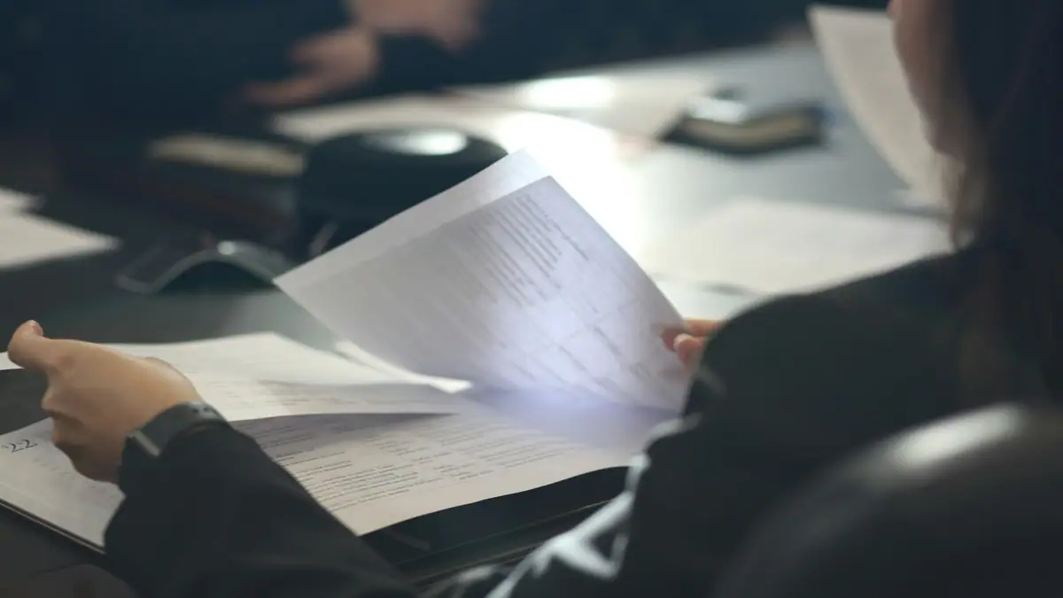 Compliance officer reviewing documents