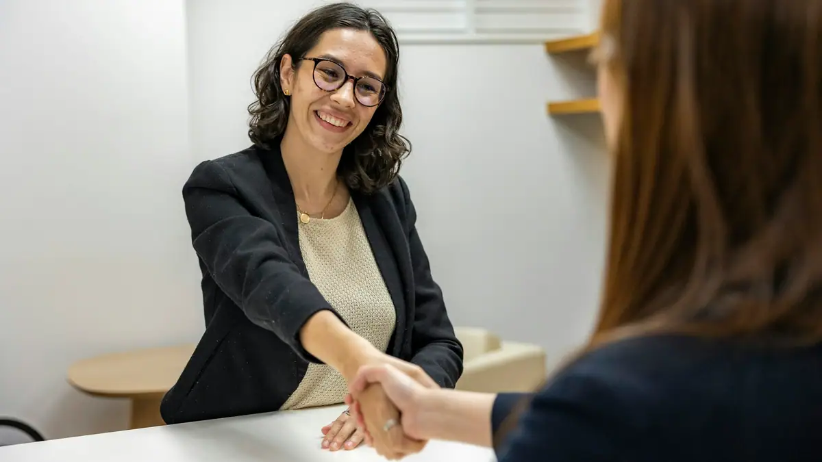 Recruiter shaking hands with a candidate after an interview