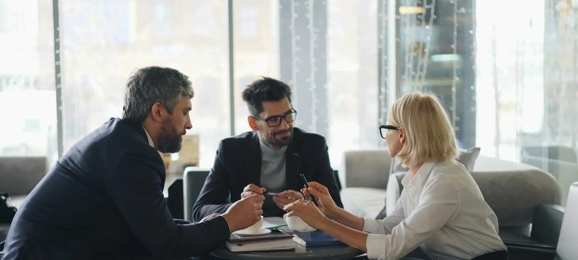 Wealth advisor meeting with clients in an office