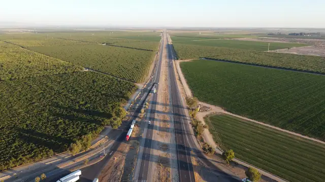 Farmland stretching across the valley near Bakersfield, California