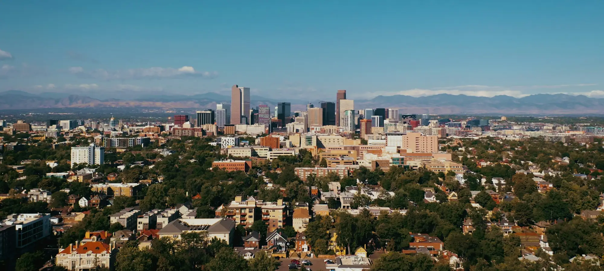 Denver skyline with the Rocky Mountains behind