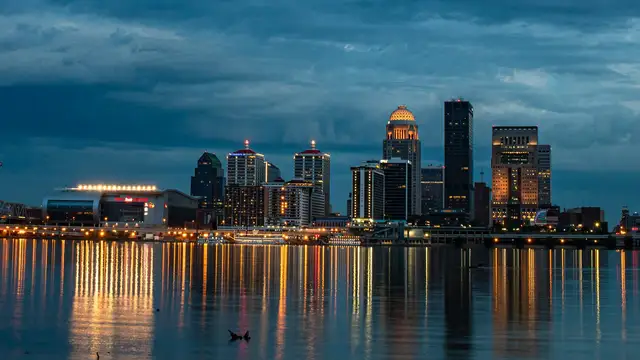 Louisville skyline reflected in the Ohio River at dusk