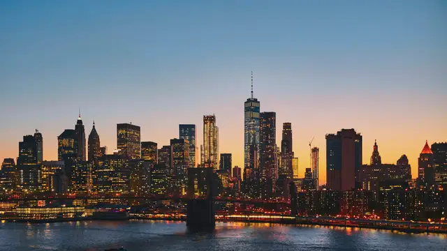 Lower Manhattan skyline and the East River at dusk
