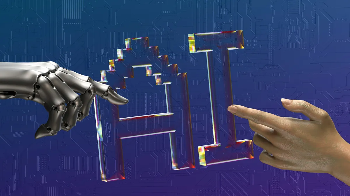 A robot hand and a human hand reaching toward the letters AI