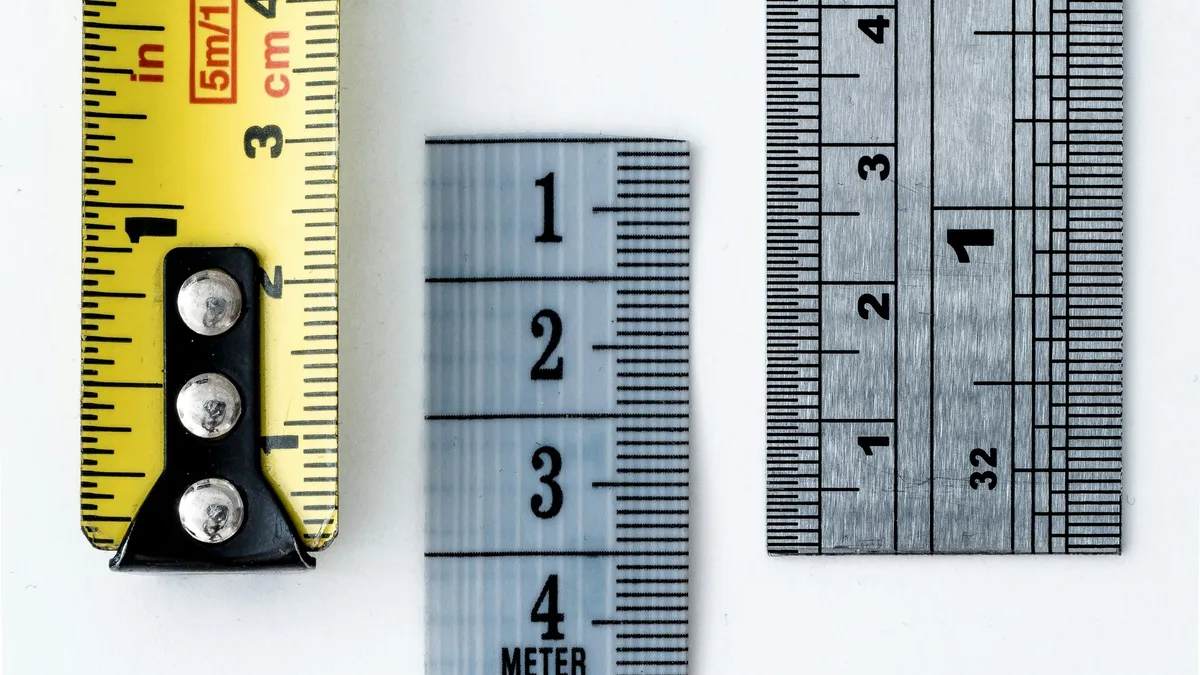 Tape measure and steel rulers side by side