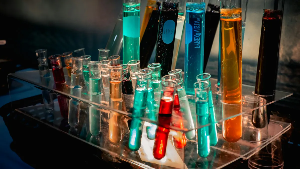 Rack of test tubes filled with colored liquids