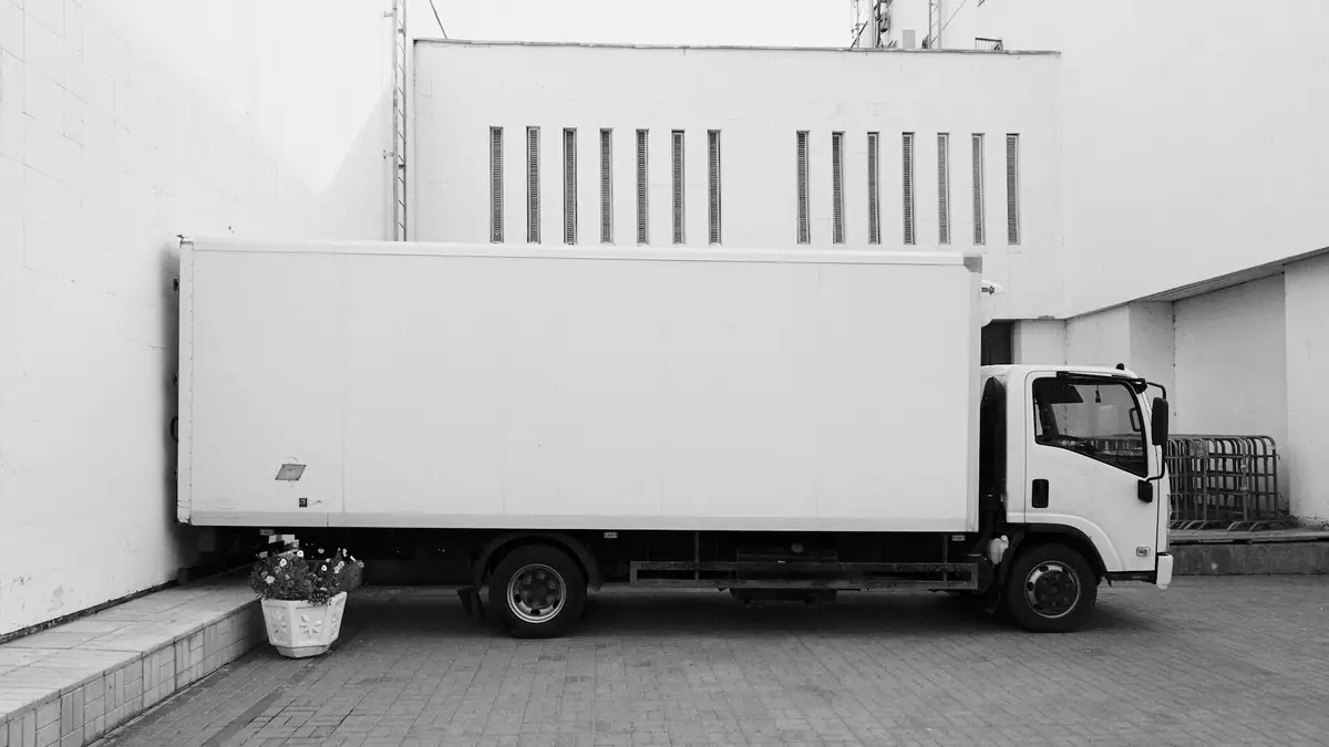 Moving truck parked at a loading dock