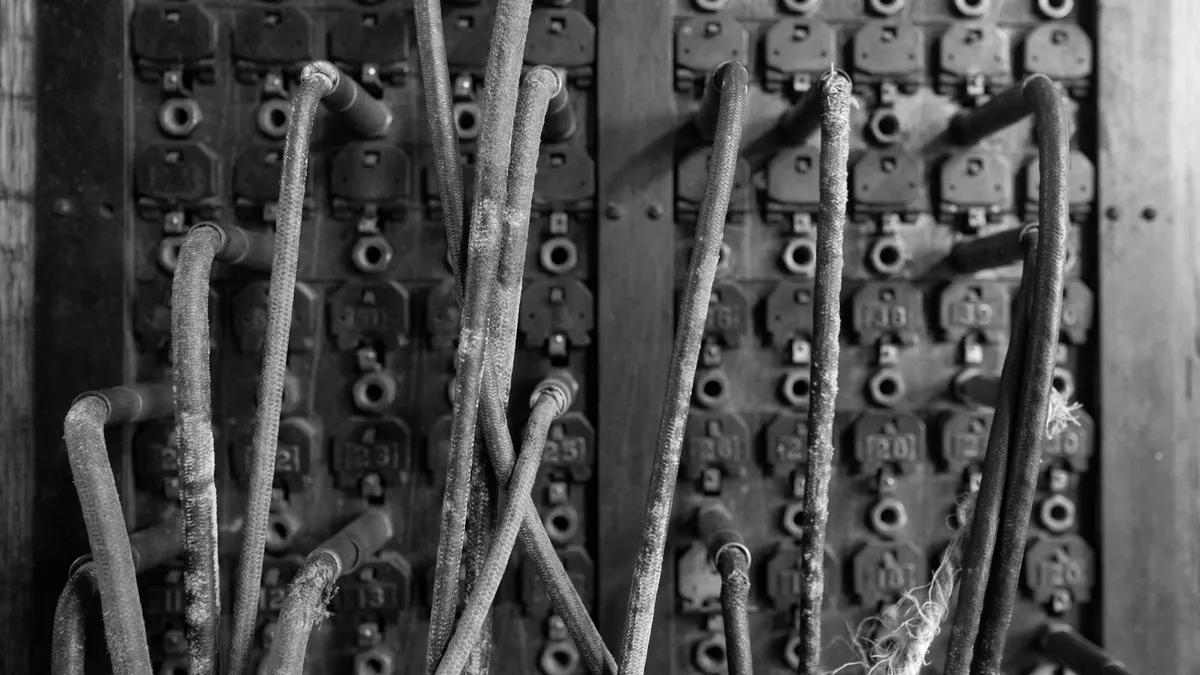 Old telephone switchboard with patch cords