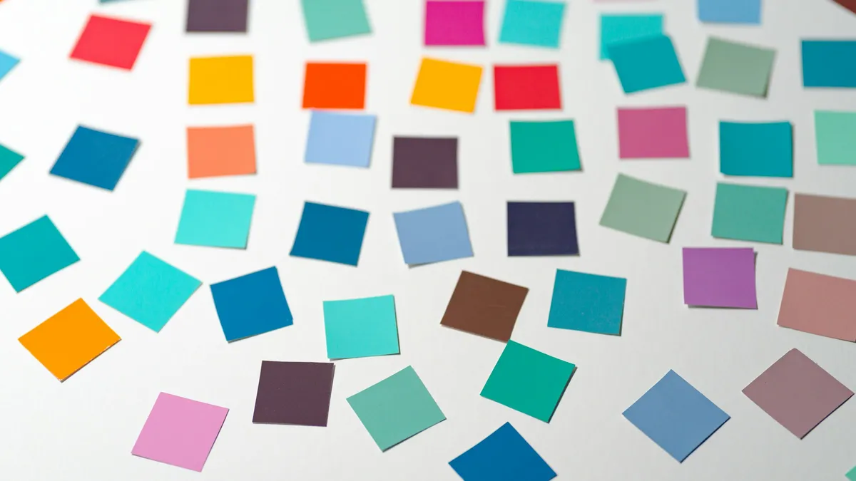 Scattered colored task cards on a white table