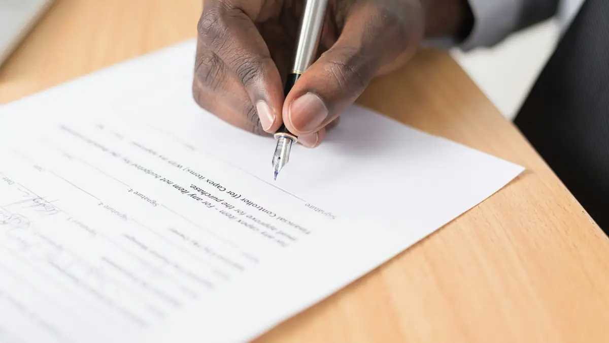 Signing a sales contract with a fountain pen