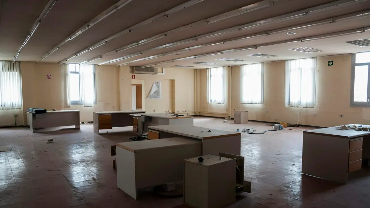 Empty office with moving boxes on the floor