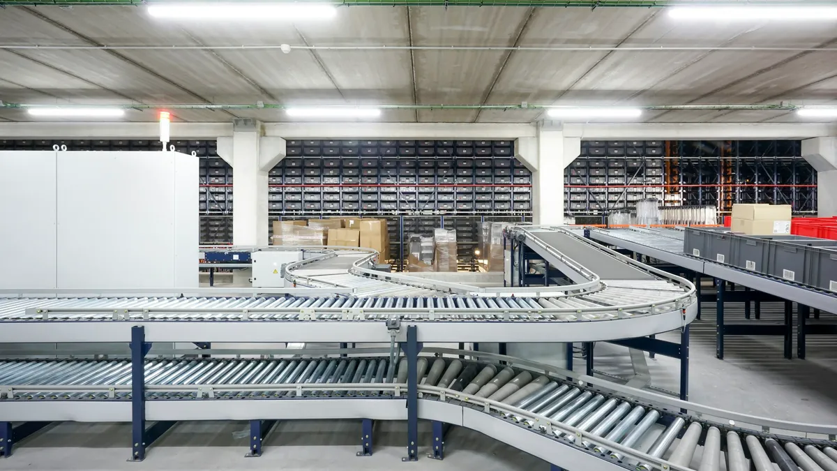 Roller conveyors curving through a warehouse