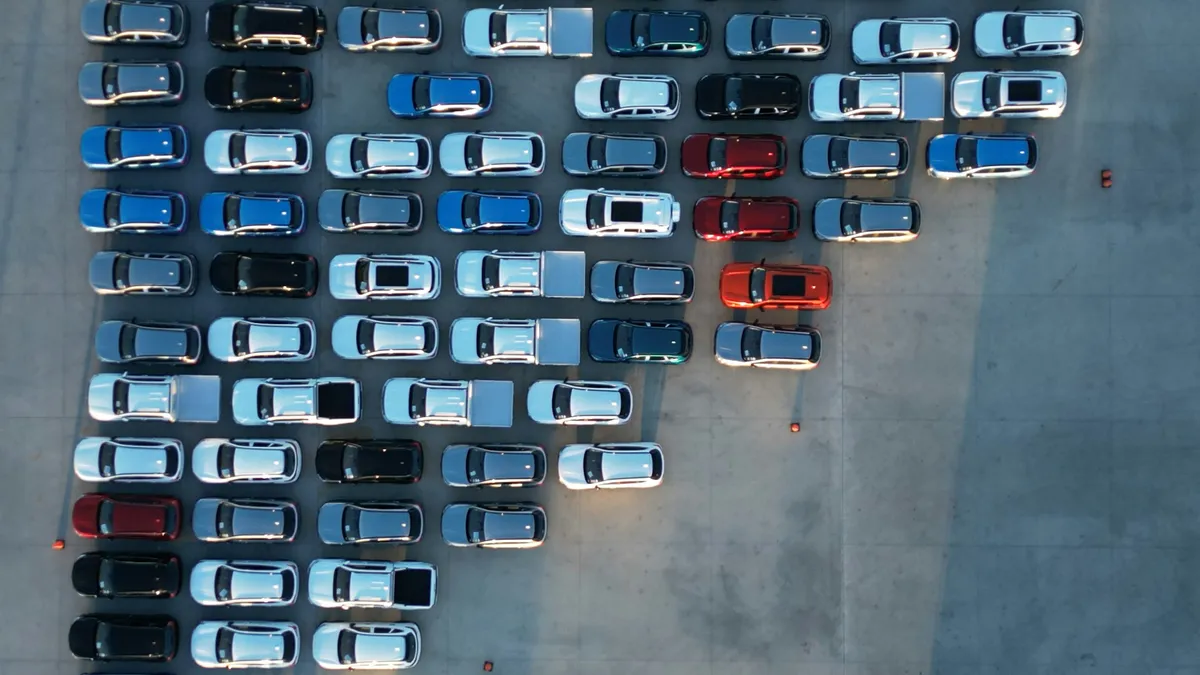 Aerial view of rows of cars parked on a lot