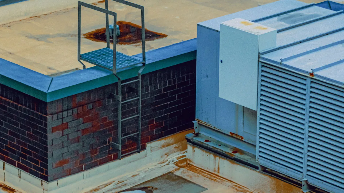 Rooftop HVAC unit and access ladder on a commercial building