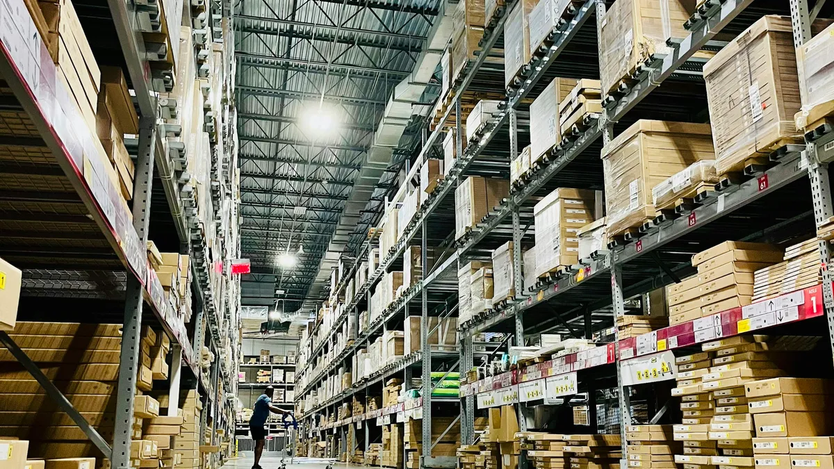 Tall warehouse racking stocked with boxed goods