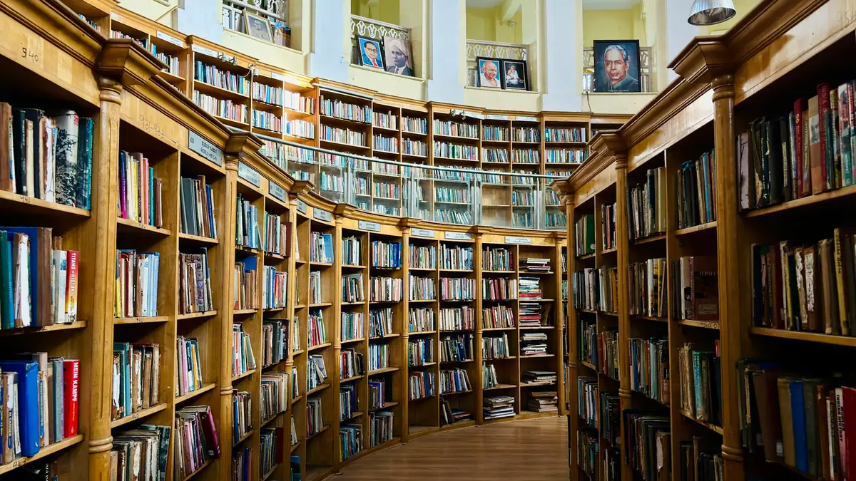 Long library aisle lined with bookshelves