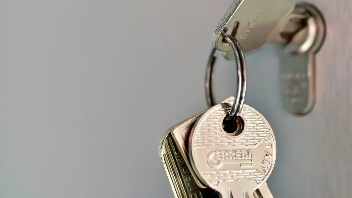 Keys on a ring hanging from a door lock