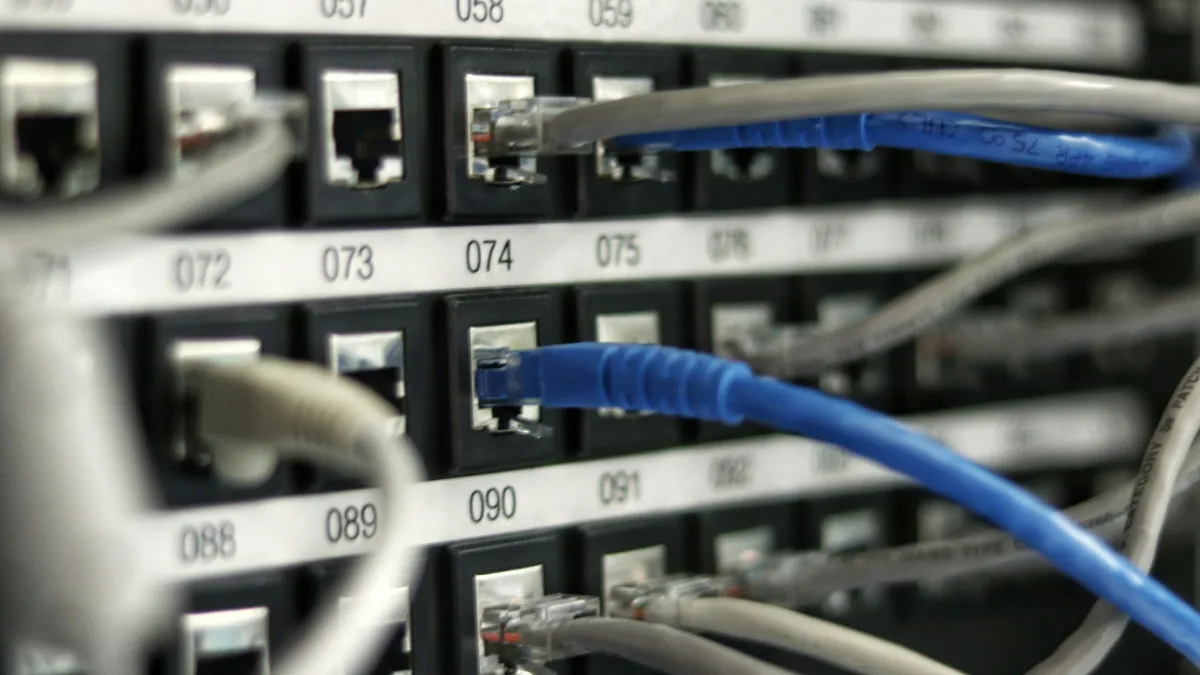 Network cables connected to a numbered patch panel