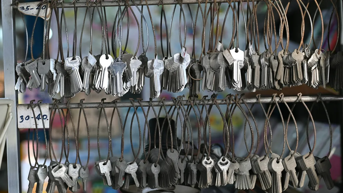 Rows of cut keys hanging on a rack