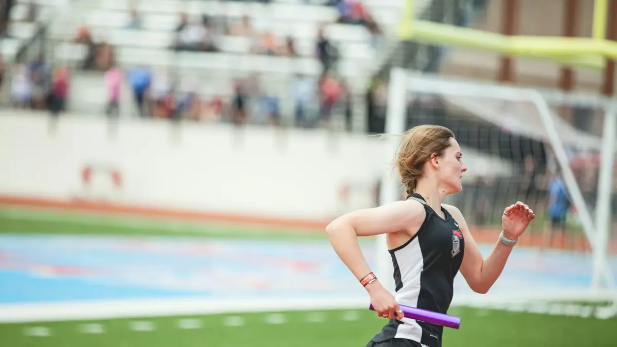 Relay runner carrying the baton