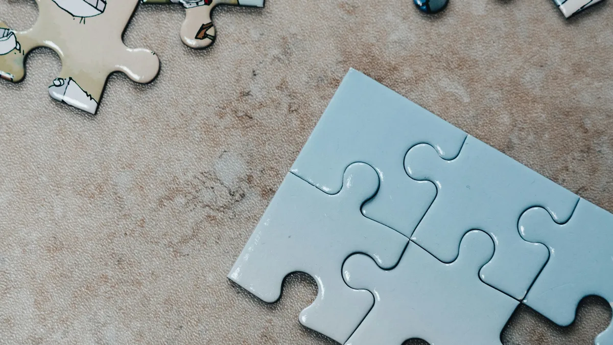 White jigsaw puzzle pieces fitted together on a table