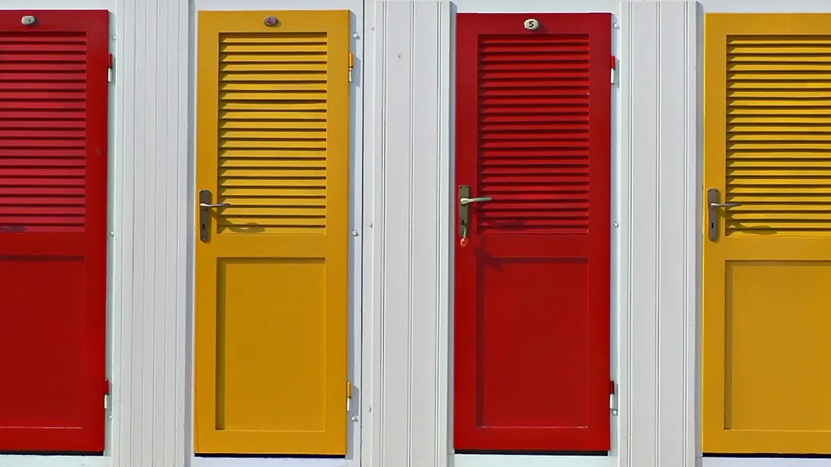Row of alternating red and yellow doors