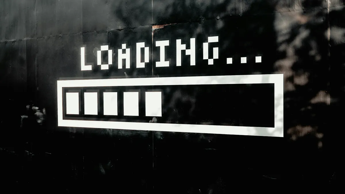 Loading bar painted on a dark wall